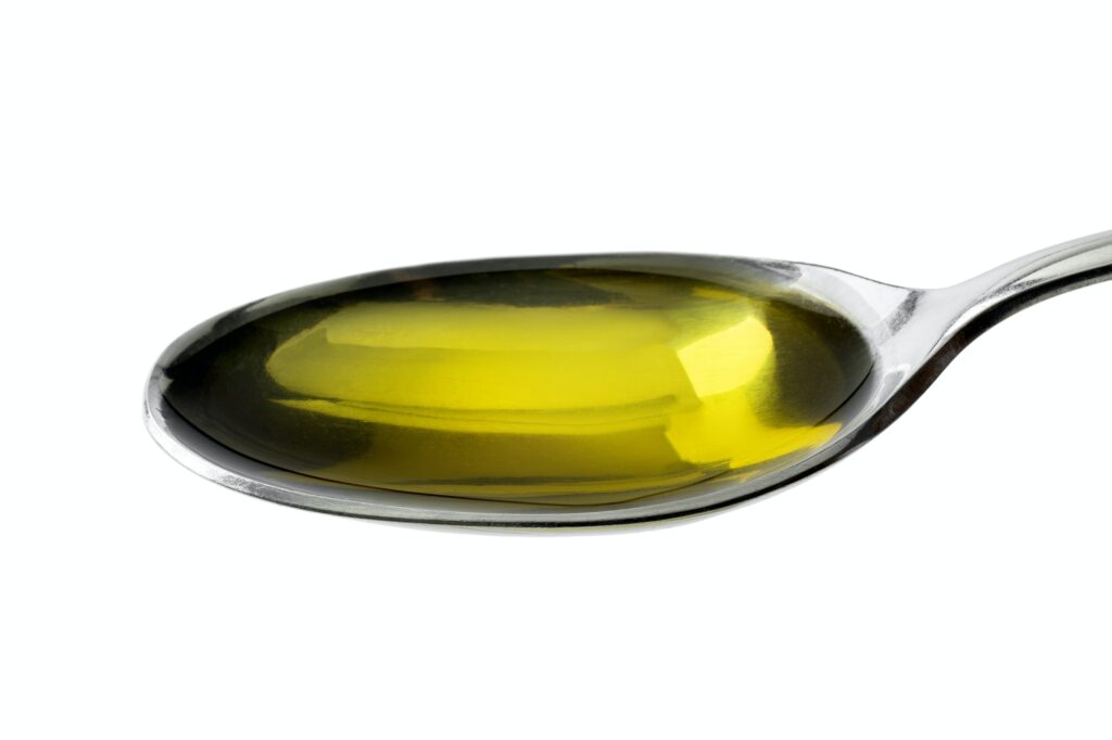 Spoon with olive oil