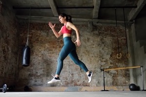 Sporty woman during hiit workout sportswoman jumpi DQRUAJ8